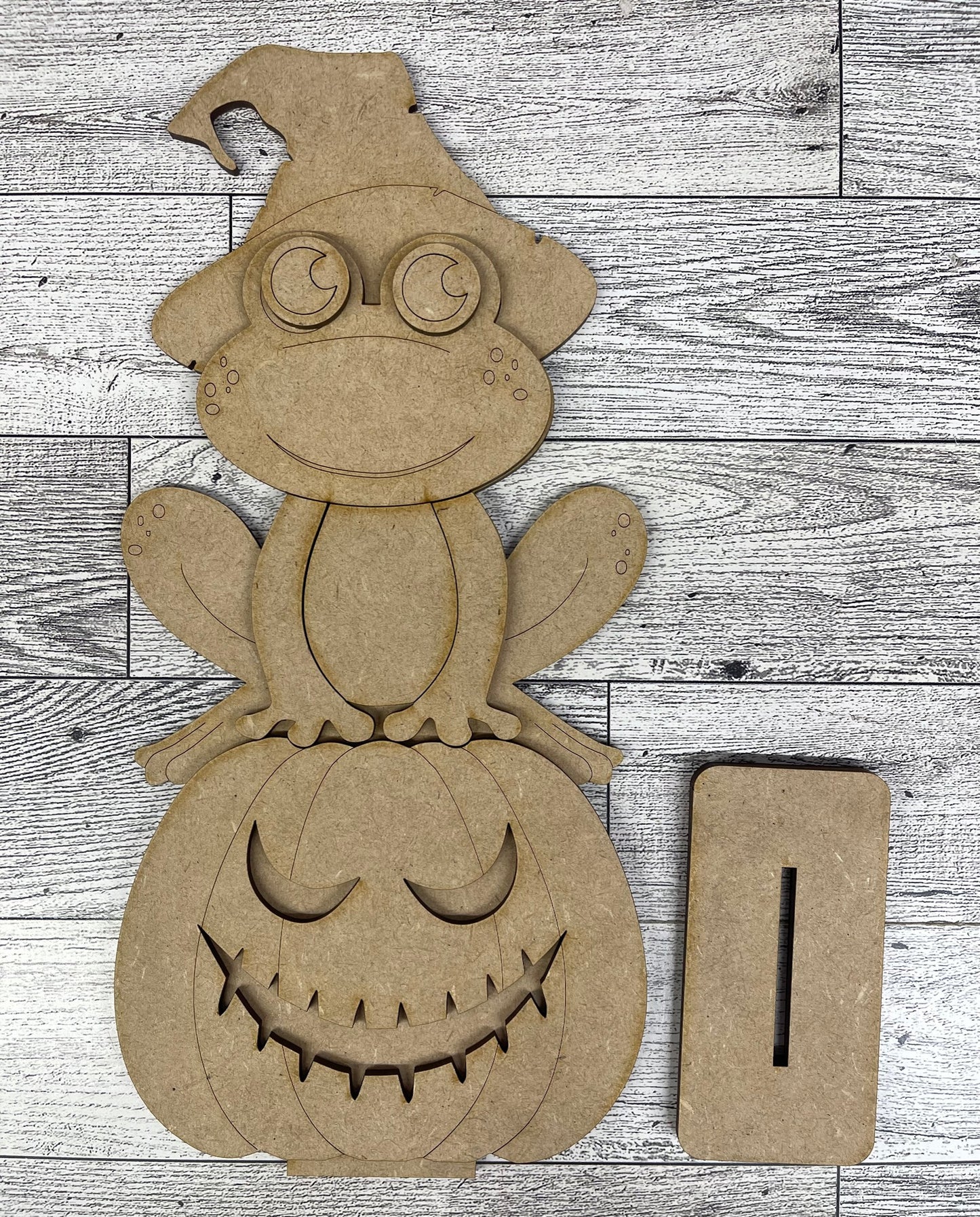 Halloween Frog Sitter hanging over shelf - unpainted wooden cutouts, ready for you to paint