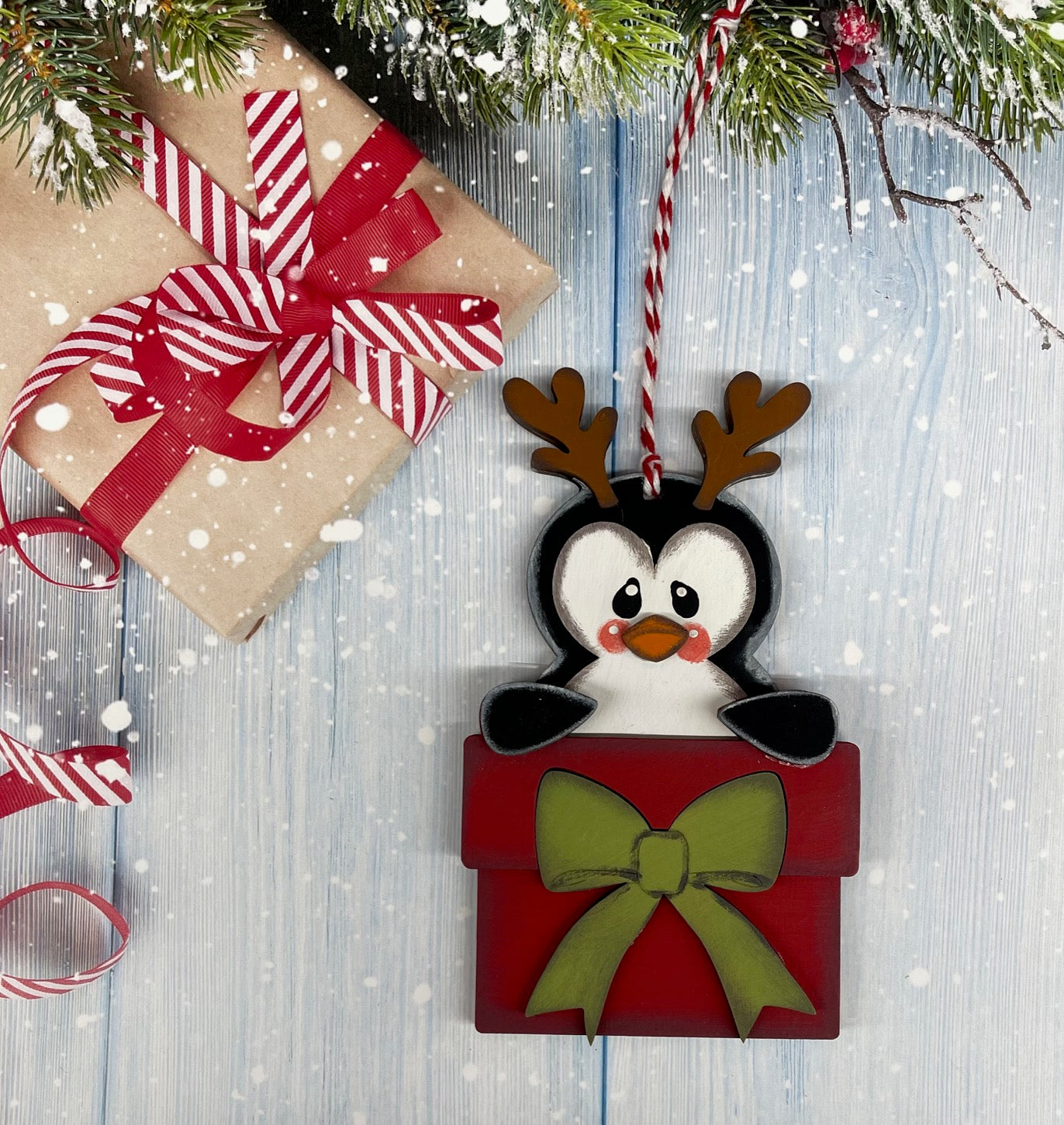 Painted Penguin with Reindeer Antlers and Present Ornament
