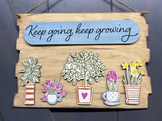 Keep going, keep growing cut out pieces to make this sign. Includes sign, oval and five plants